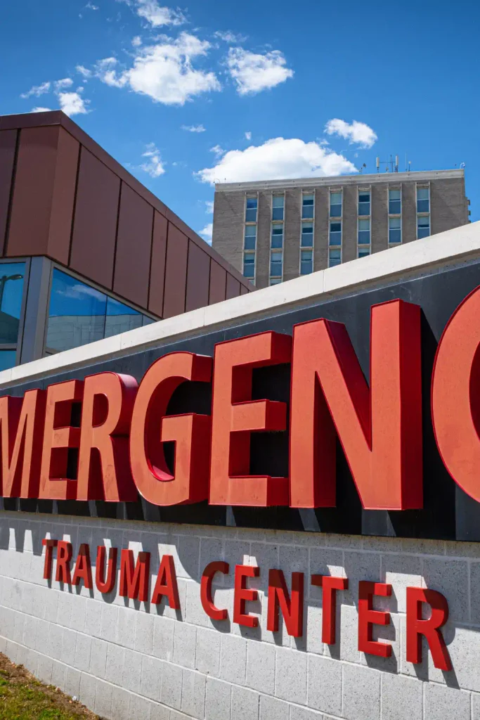 Emergency Trauma Center sign on a hospital building exterior